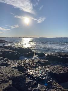 rocks and the ocean during the daytime