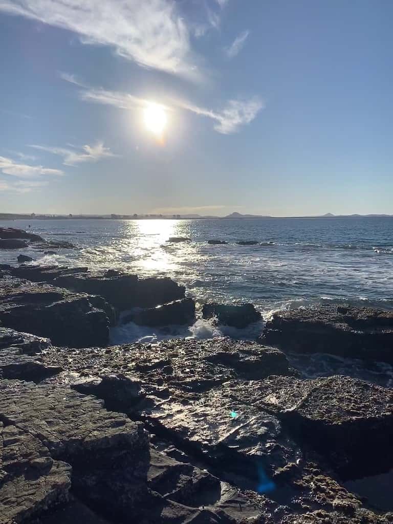 rocks and the ocean during the daytime