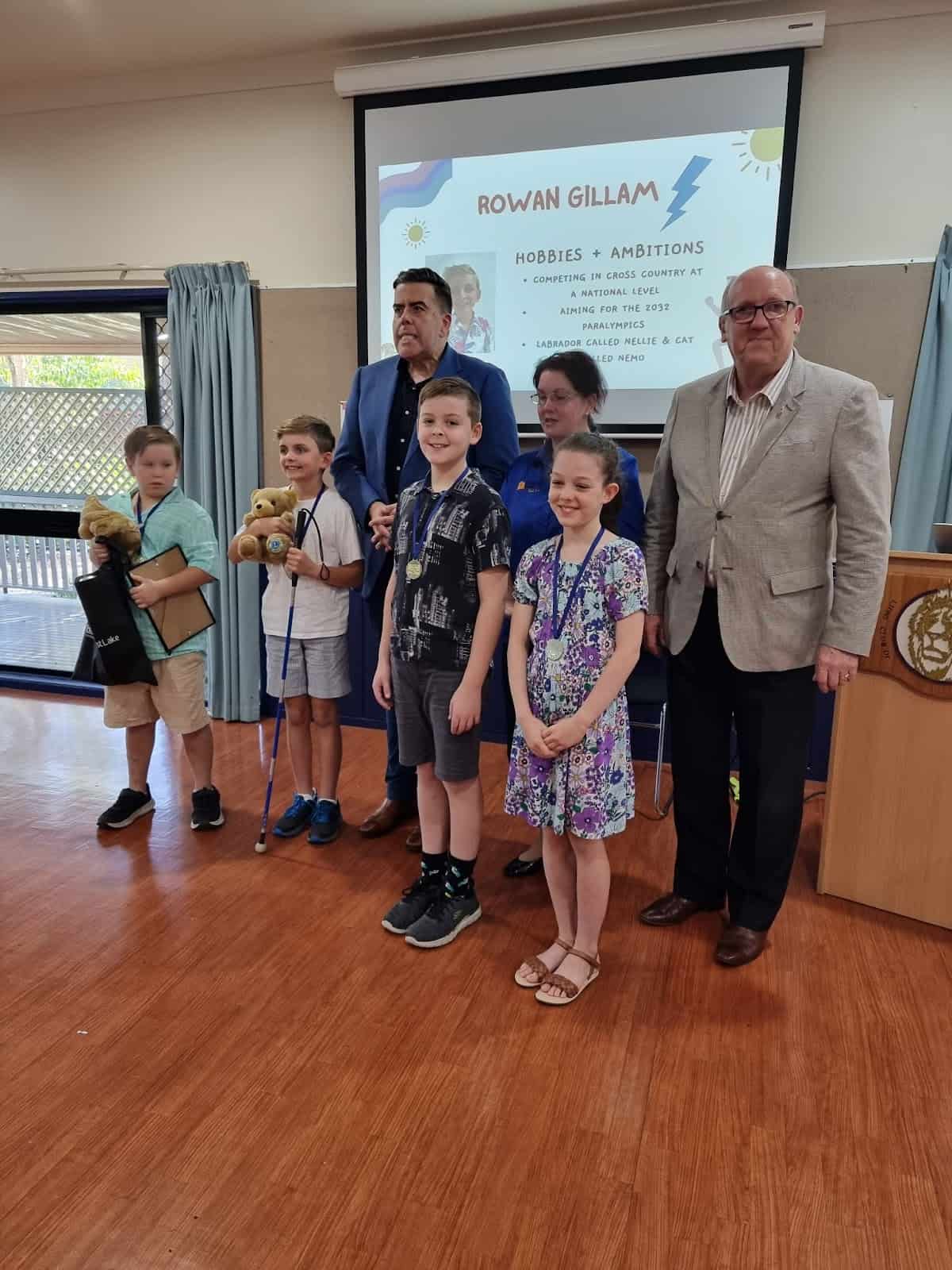 (Left to right) Tyler Duthie, Rowan Gillam, Federal Oxley MP Milton Dick, Maxwell Purcell, District Chair for Children of Courage Lion April Lindel, Zoe Thomas and Brisbane City Forest Lake Ward Councilor Charles Strunk.