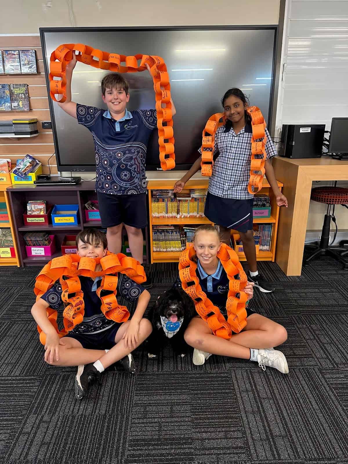 Year six students with Poppy, the Grand Avenue State School therapy dog.